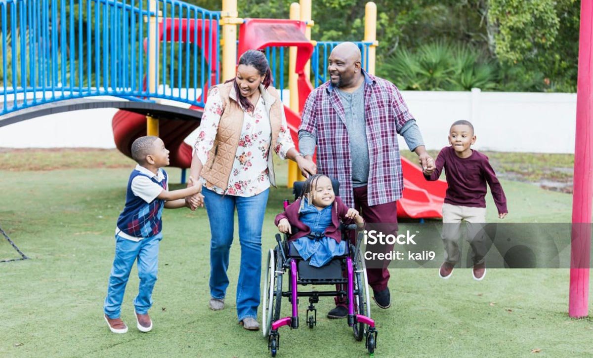 Family with special needs child in park